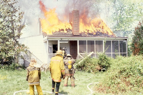 image of fire fighters putting out a house fire